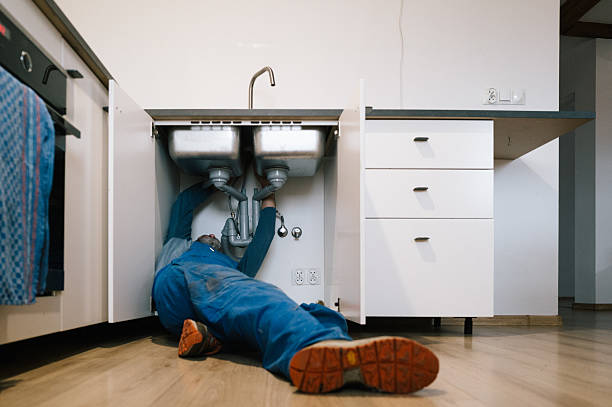 Professional Drain Cleaning technician working in Wellesley Hills, MA